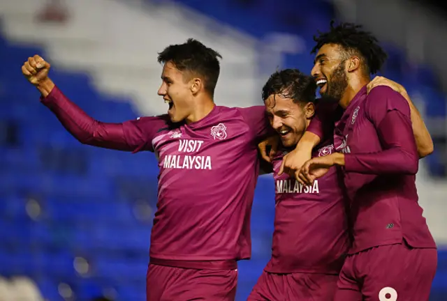 Ryan Wintle of Cardiff City celebrates with teammates after scoring the team's second goal