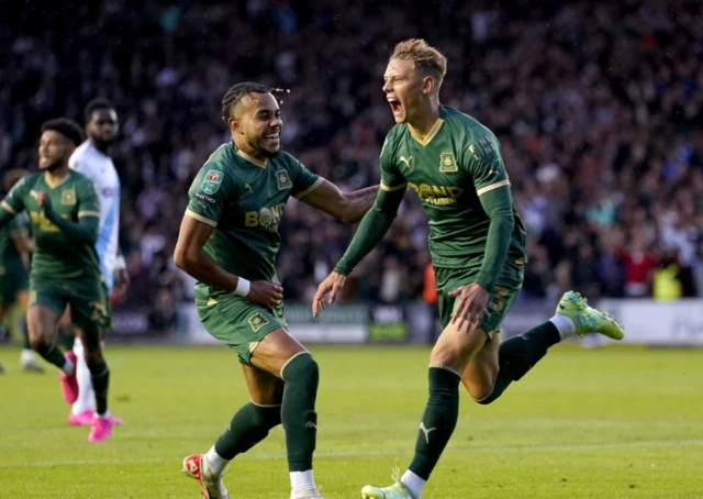 Plymouth Argyle's Ben Waine (right) celebrates scoring their side's first goal of the game during