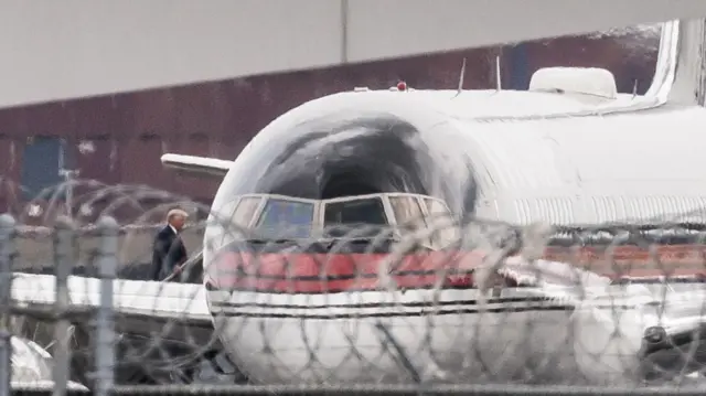 Former US President Donald J Trump boards his plane at Newark Liberty International Airport