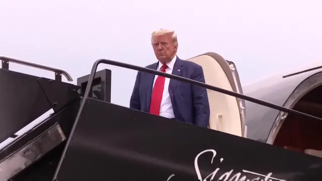 Trump getting off the plane