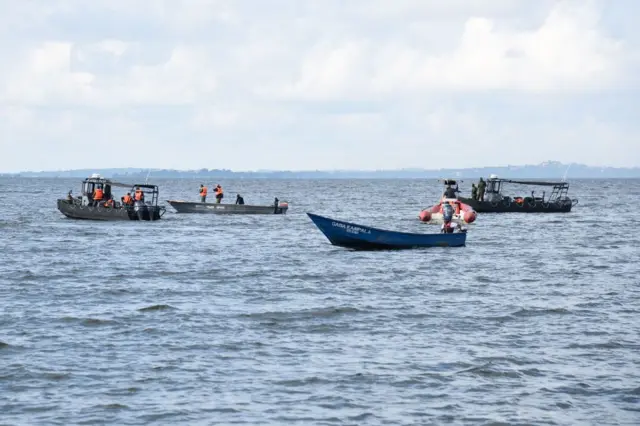 Local fishermen and Ugandan Navy personnel search passengers of capsized cruise boat on lake Victoria at Mutima village, about 50km south of capital Kampala in November 2018