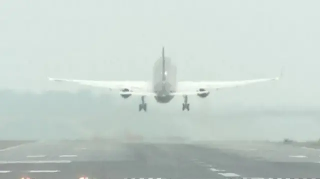 Donald Trump's plane in the air, shortly after taking off from an airport runway in Washington DC