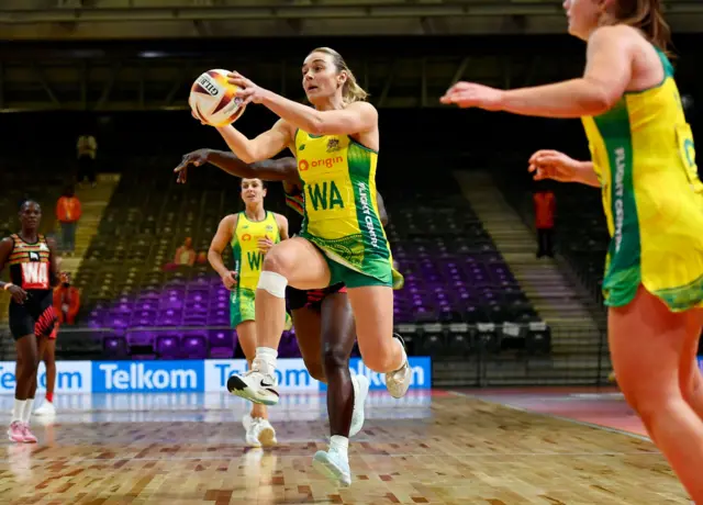 Liz Watson catches the ball in midair for Australia.