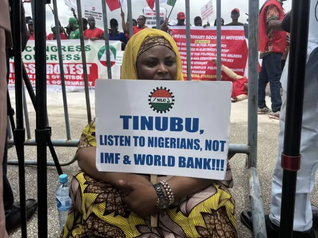 People gather to protest against the increase in fuel prices and the cost of living in the country