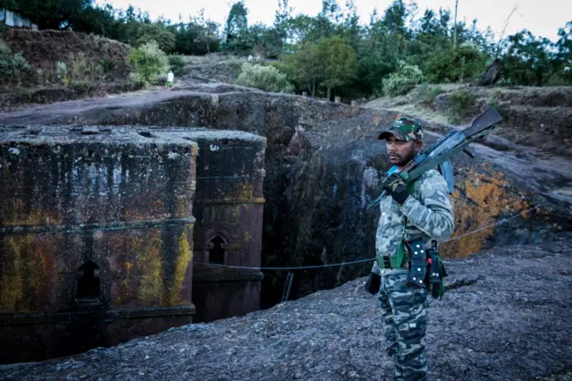 Amhara Fano militia fighter Eshete Zewudru poses at Saint George Church in Lalibela, on December 7, 2021.