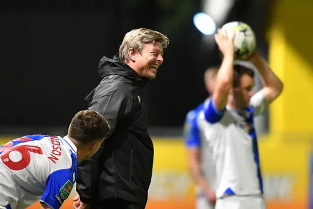 Blackburn Rovers' Manager Jon Dahl Tomasson smiles on the touchline