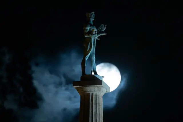 The "Blue Supermoon", the second full moon of a calendar month, rises behind the landmark monument 'The Victor' ('Pobednik' in Serbian) in Belgrade on August 30, 2023