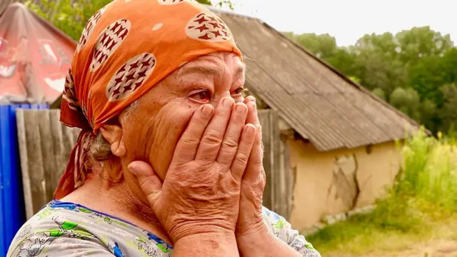 Antonina Semenivna, a Ukrainian woman, cries as she talks to the BBC