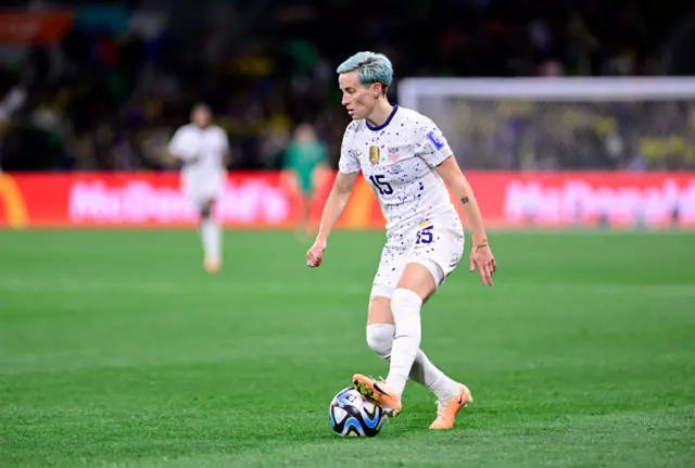 Megan Rapinoe controls a ball