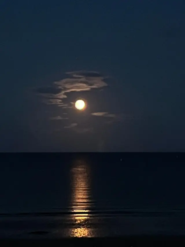 Shot of the moon over Bridlington beach