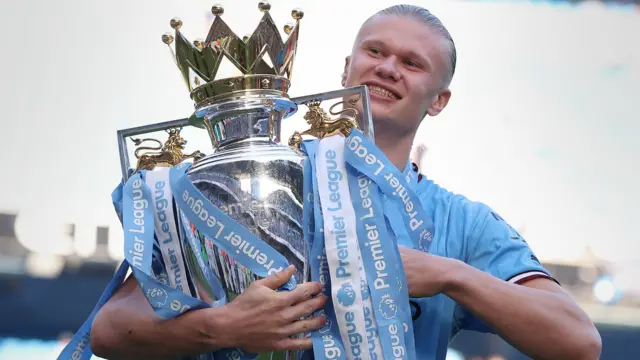 Erling Haaland with the Premier League trophy