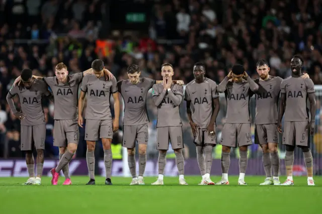 Tottenham players bow their heads after Davinson Sanchez misses a penalty