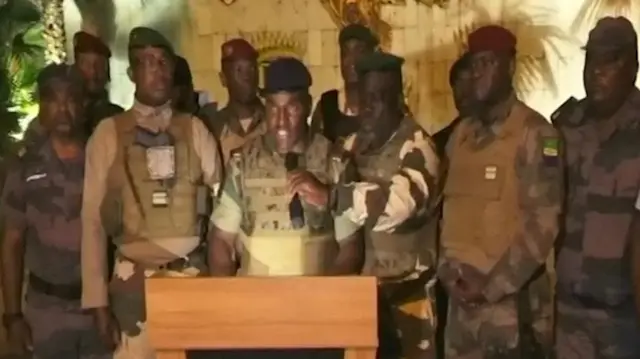 Gabonese military appear on television as they announce that they have seized power following President Ali Bongo Ondimba's re-election, in this screengrab obtained by Reuters on August 30, 2023.