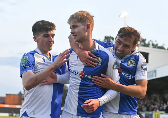 Jack Garrett celebrates with teammates after scoring