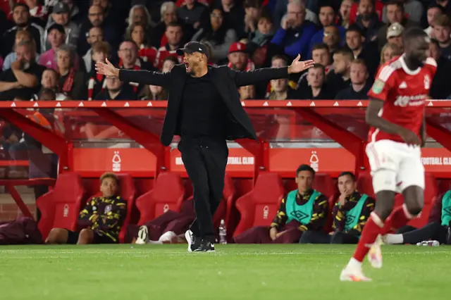 Vincent Kompany with his arms wide open on the touchline