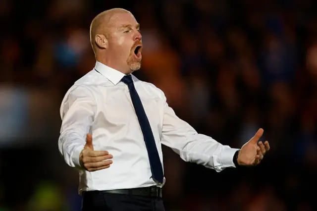 Sean Dyche on the touchline with his arms aloft shouting