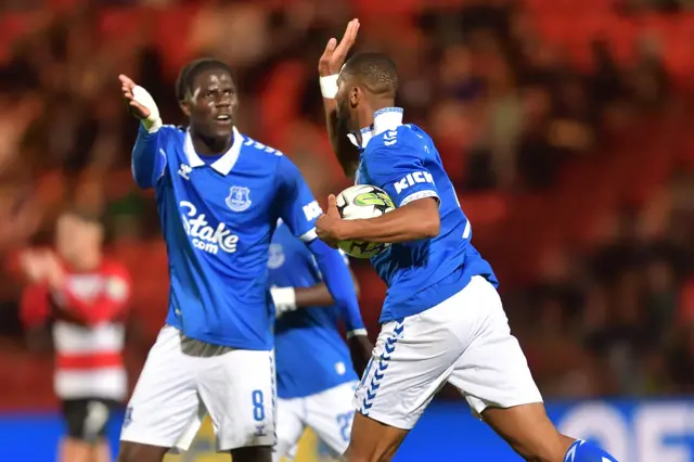 Beto of Everton celebrates his goal with Amadou Onana