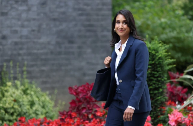 Claire Coutinho walks up Downing Street