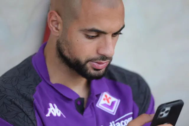 Sofyan Amrabat on his phone