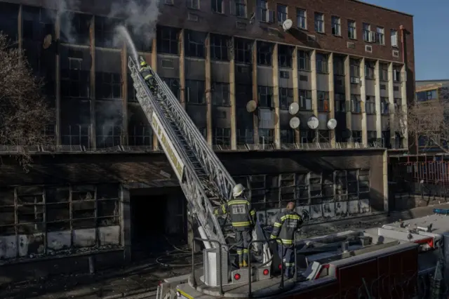 Firefighters put out a fire in a building in Johannesburg on 31 August 2023