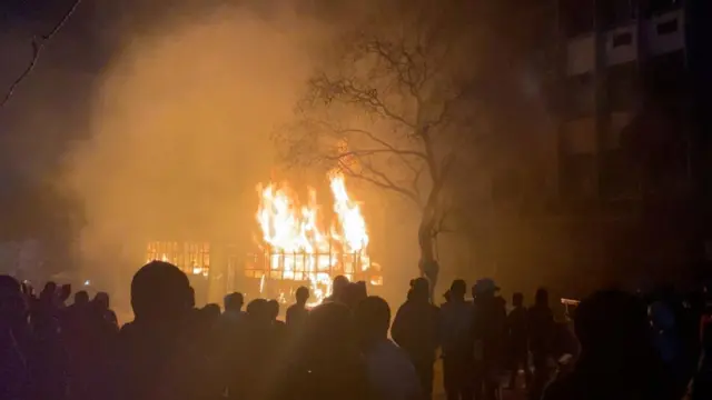 Crowds gather near a building on fire in Johannesburg, South Africa