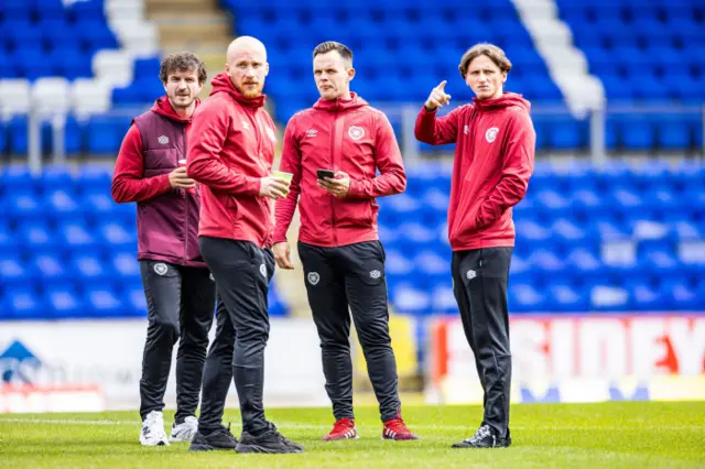 Alex Lowry (right) has some pre-match discussions with his new teammates