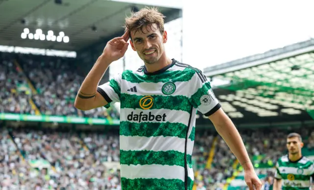 Matt O'Riley celebrates scoring for Celtic against Ross County