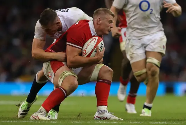 Jac Morgan tackled by Freddie Steward