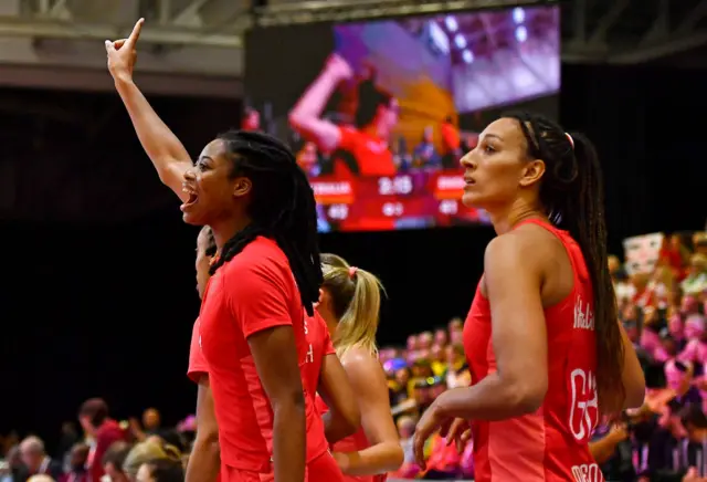 Liv Tchine shouts instructions onto court from the bench.