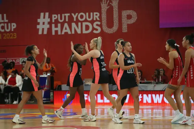 Helen Housby high fives her England team mates.