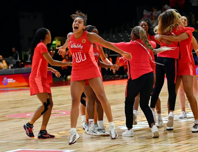 Imogen Allison celebrates with her arms wide after England's win over Australia.