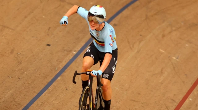 Lotte Kopecky punches the air after winning