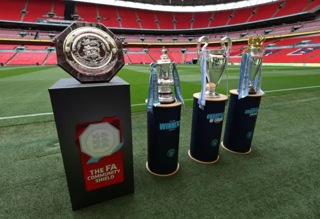 The Community shield, the FA Cup, the Champions League trophy and the Premier League trophy at Wembley