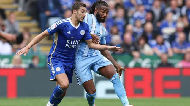 Kasey Palmer and Harry Winks battle for the ball