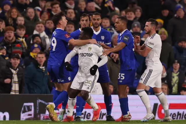 Wilfried Gnonto clashes with Cardiff players during Leeds' FA Cup replay win last season