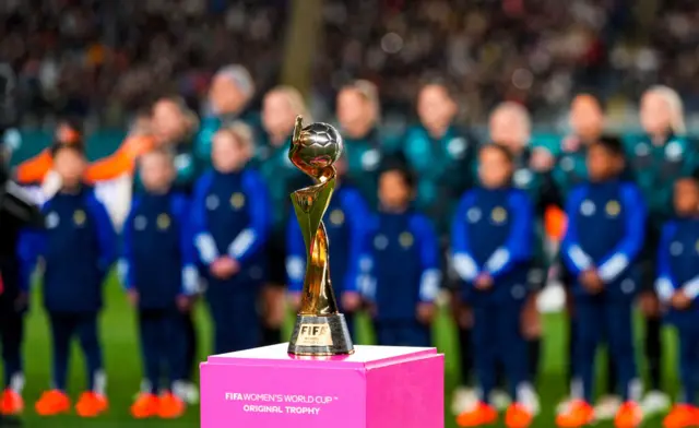 Women's world cup trophy stands on the pitch ahead of kick off.