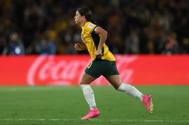 Sam Kerr runs onto the pitch for the first time in the tournament.