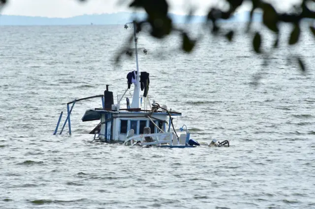 MV K-Palm, the cruise boat which capsized and killed at least 32 people, is salvaged by divers in Lake Victoria near Mutima village, south of Kampala, on November 29, 2018