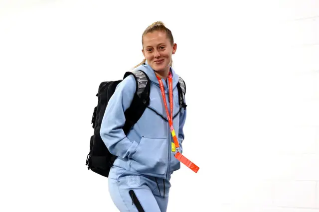 Keira Walsh smiles for the camera as she arrives at the stadium.