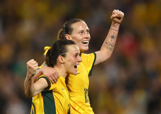 Rado celebrates her goal with teammate van Egmond.