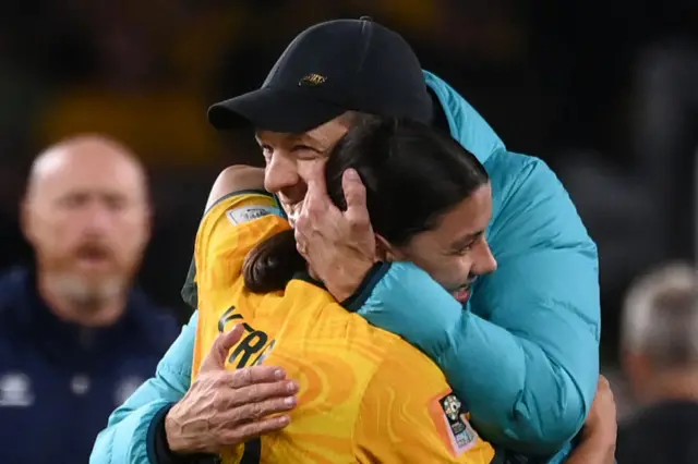 Sam Kerr shares an embrace with Tony Gustavsson after the full time whistle.