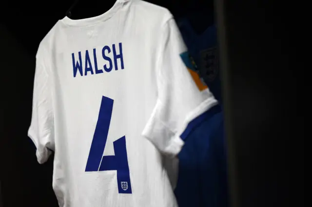 Keira Walsh' shirt hangs up in the dressing room.