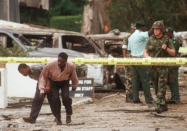 People looking at the wreckage of the bombing