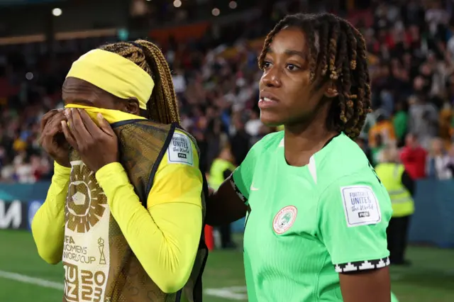 Jennifer Echegini and Zainab Balogun of Nigeria show dejection after the team's defeat through the penalty shoot out in the FIFA Women's World Cup