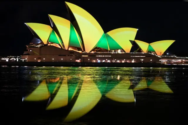 The Sydney Opera house is lit up in green and gold for the Matildas.