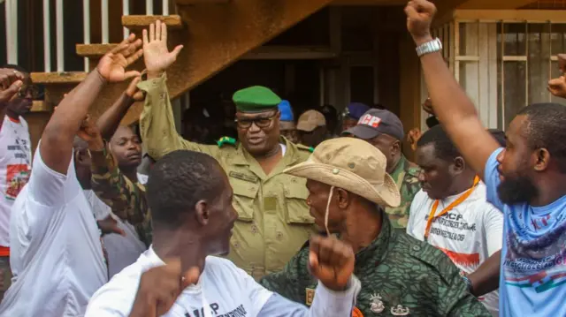 Supporters of Niger's coup leaders take part in a rally at a stadium i