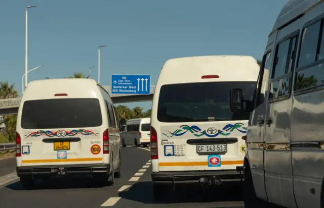 Minibus taxis on a road in Cape Town