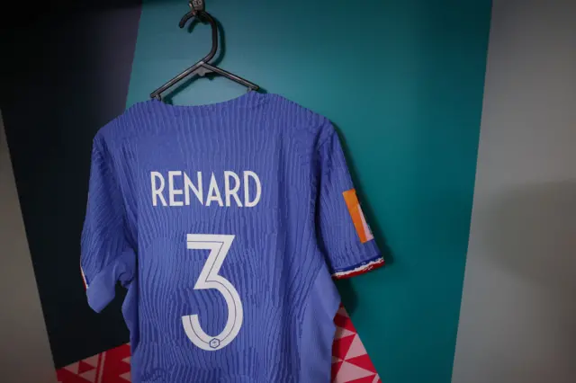 Renard's shirt hangs ready in the dressing room.