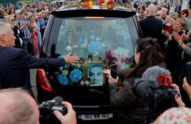 A hearse carrying the coffin of late Irish singer Sinead O'Connor