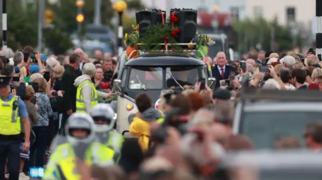 Van with speakers on the roof in Sinead O'Connor's cortege
